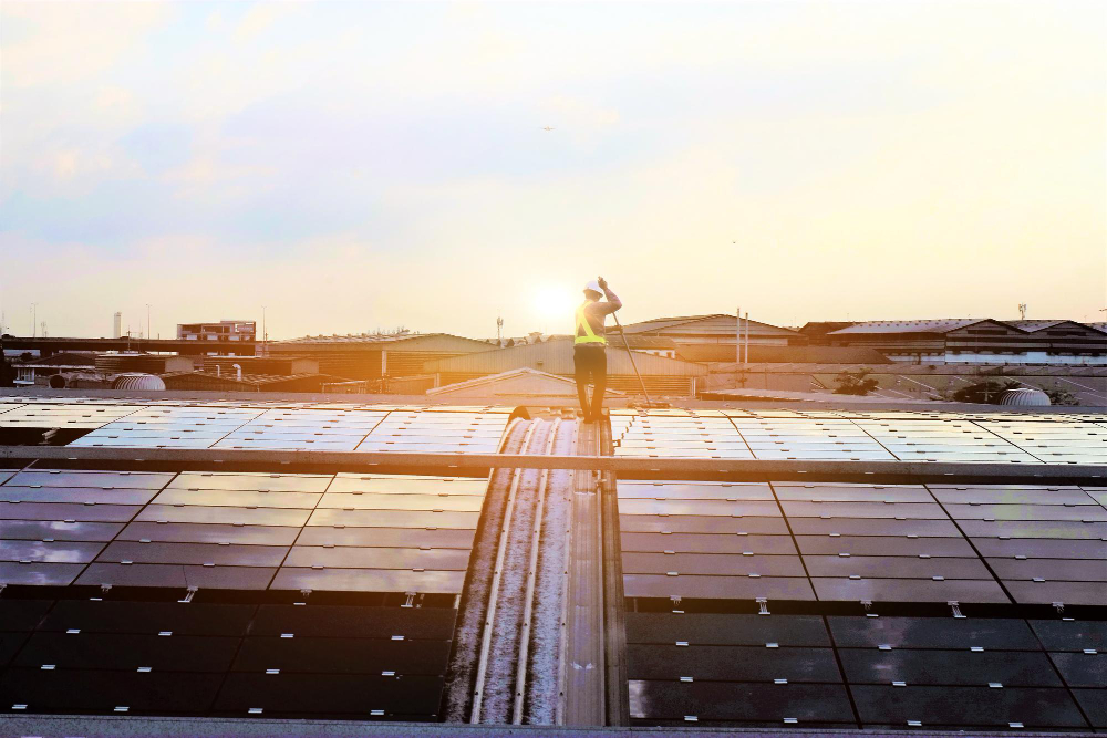 Picture of a Man Cleaning Solar Panels