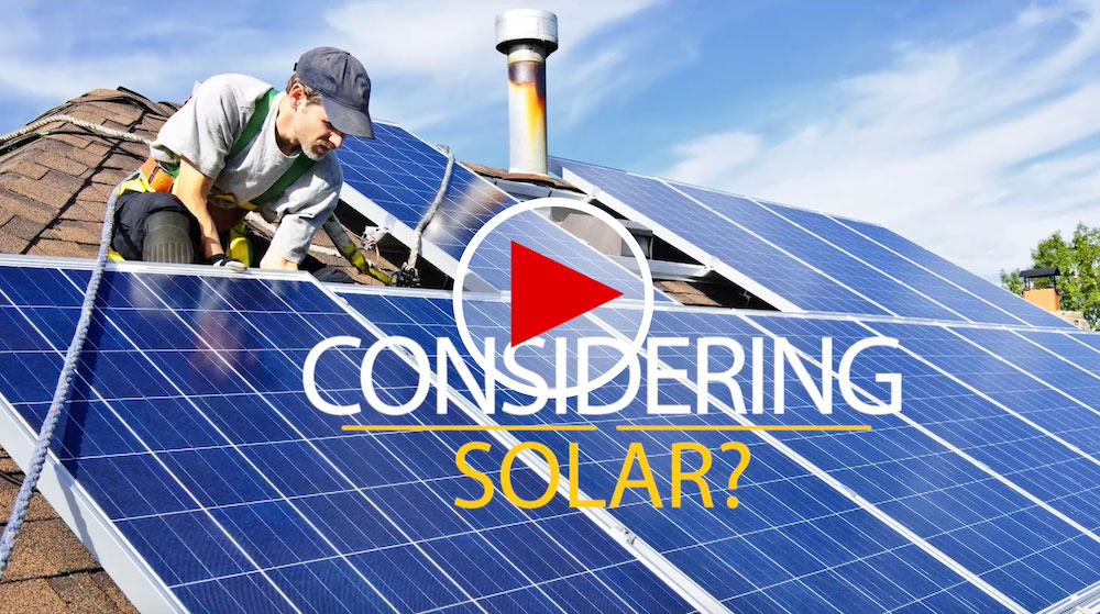 Picture of Man Working on Solar Panels with a Link to a Video About Considering Solar on YouTube