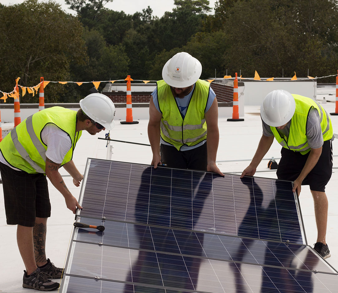 Picture of Three Workers Installing Solar Panels