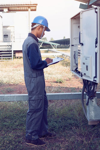 Picture of Worker Checking on an Inverter